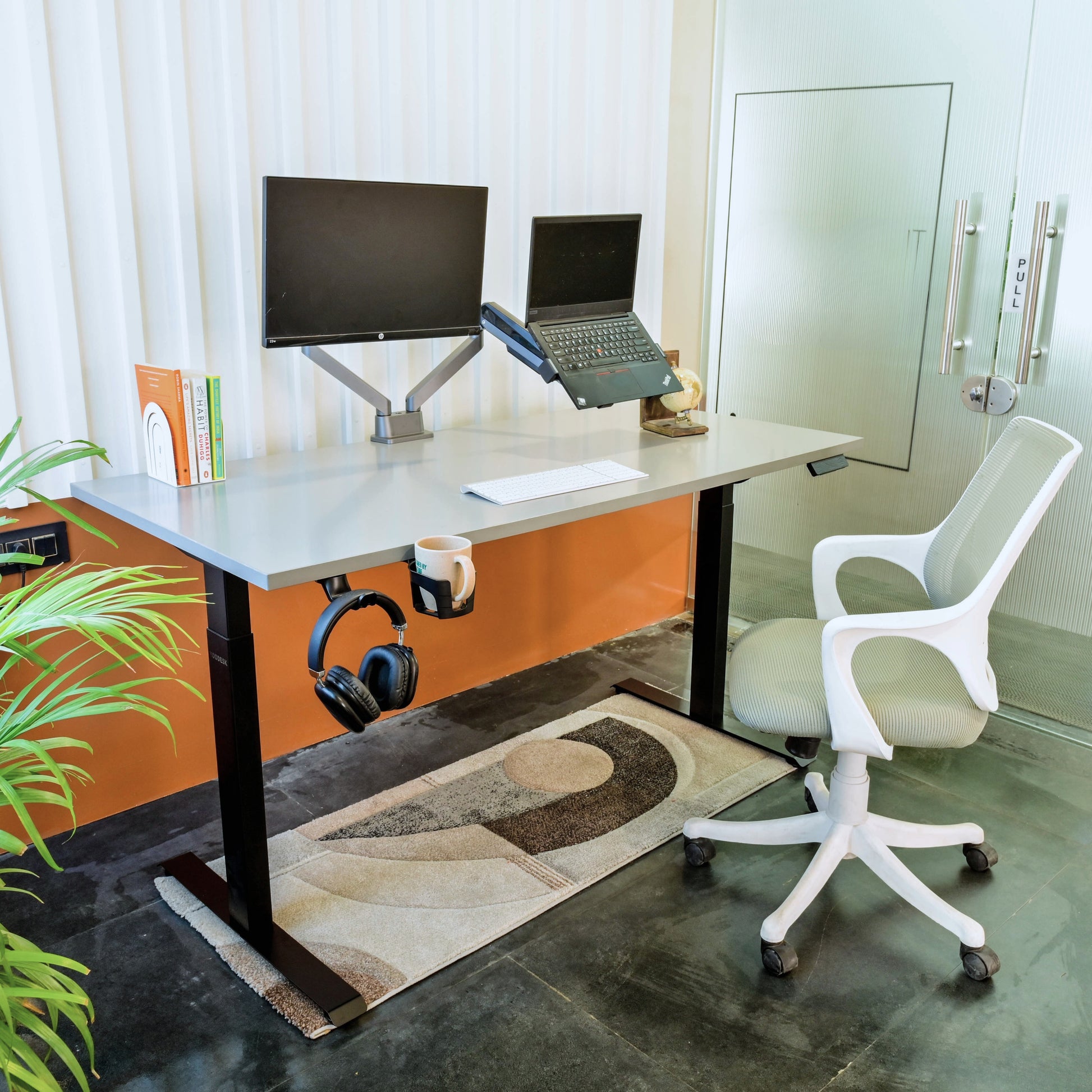 Pro Series height adjustable desk frame in a modern office setup
